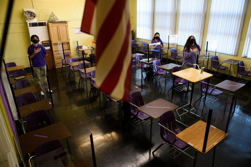 Students stand for the Pledge of Allegiance as they return to in-person learning at St. Anthony Catholic High School in California on March 24. Masks and physical distancing are proving to have some major public health benefits, keeping people from gettin Students stand for the Pledge of Allegiance as they return to in-person learning at St. Anthony Catholic High School in California on March 24. Masks and physical distancing are proving to have some major public health benefits, keeping people from gettin