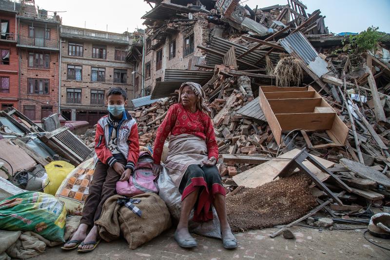 A grandmother and her grandson sit on the belongings that they have salvaged from their collapsed homes on April 29, 2015 in Bhaktapur, Nepal. A grandmother and her grandson sit on the belongings that they have salvaged from their collapsed homes on April 29, 2015 in Bhaktapur, Nepal.