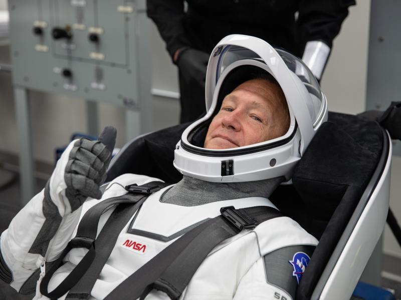 NASA astronaut Doug Hurley rehearses putting on his SpaceX spacesuit last week at the Neil A. Armstrong Operations and Checkout Building at Kennedy Space Center in Florida. NASA astronaut Doug Hurley rehearses putting on his SpaceX spacesuit last week at the Neil A. Armstrong Operations and Checkout Building at Kennedy Space Center in Florida.