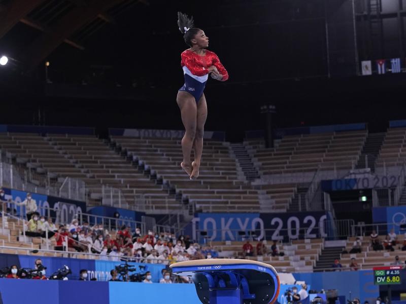 Simone Biles from the U.S. performs on the vault during the gymnastics women's team final at the Summer Olympics on Tuesday in Tokyo. Simone Biles from the U.S. performs on the vault during the gymnastics women's team final at the Summer Olympics on Tuesday in Tokyo.