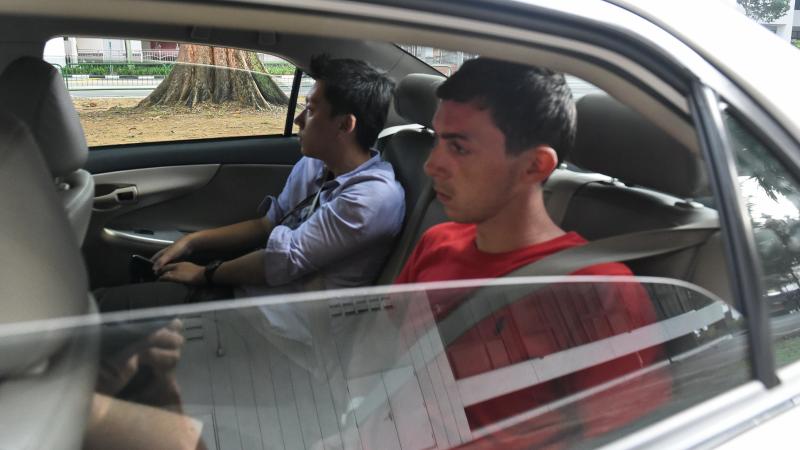 Andreas Von Knorre (right), one of two German nationals arrested for vandalism in Singapore, arrives in a police car at the state court on Nov. 22, 2014. Both men were sentenced Thursday to a prison term and caning. Andreas Von Knorre (right), one of two German nationals arrested for vandalism in Singapore, arrives in a police car at the state court on Nov. 22, 2014. Both men were sentenced Thursday to a prison term and caning.