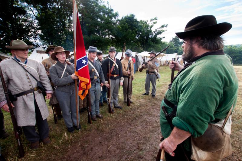 Waverly Adcock, a sergeant and founder of the West Augusta Guard, prepares his company for inspection and battle at a Civil War re-enactment in Virginia. Sara Smith, whose great-great-grandfather was wounded at the Battle of Gettysburg, holds the Confeder Waverly Adcock, a sergeant and founder of the West Augusta Guard, prepares his company for inspection and battle at a Civil War re-enactment in Virginia. Sara Smith, whose great-great-grandfather was wounded at the Battle of Gettysburg, holds the Confeder
