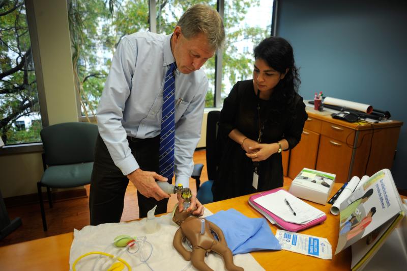 Baby "NeoNatalie" waits to be saved, as Dr. Mark Hathaway gives NPR's Malaka Gharib a lesson on getting an infant to take its first breath. Baby "NeoNatalie" waits to be saved, as Dr. Mark Hathaway gives NPR's Malaka Gharib a lesson on getting an infant to take its first breath.