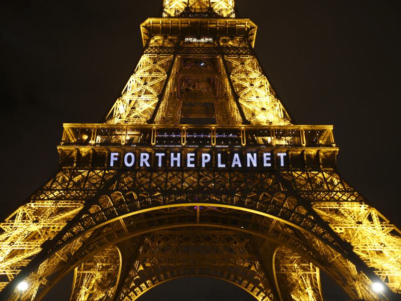 The slogan "For The Planet" is projected on the Eiffel Tower as part of the United Nations Climate Change Conference in Paris in December 2015. The slogan "For The Planet" is projected on the Eiffel Tower as part of the United Nations Climate Change Conference in Paris in December 2015.