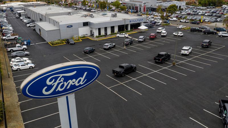 Vehicles sit in a nearly empty lot at a car dealership in Richmond, Calif., on July 1. The global semiconductor shortage has hobbled auto production worldwide, making it difficult to find a car to buy. Vehicles sit in a nearly empty lot at a car dealership in Richmond, Calif., on July 1. The global semiconductor shortage has hobbled auto production worldwide, making it difficult to find a car to buy.