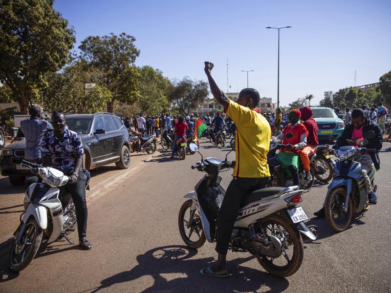 People cheer in support of putschist soldiers near the national television station in Ouagadougou on Monday. Two mutinous soldiers told The Associated Press that Burkina Faso's President Roch Marc Christian Kabore is being held by the rebellious soldiers. People cheer in support of putschist soldiers near the national television station in Ouagadougou on Monday. Two mutinous soldiers told The Associated Press that Burkina Faso's President Roch Marc Christian Kabore is being held by the rebellious soldiers.