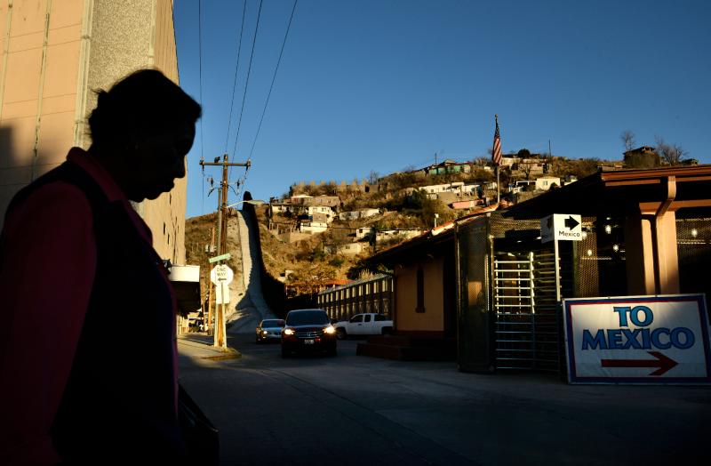 A woman walks toward the international crossing gate in Nogales, Ariz., in March 2013. A woman walks toward the international crossing gate in Nogales, Ariz., in March 2013.