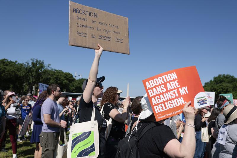 A protester carries a sign as they attend the "Jewish Rally for Abortion Justice" rally at Union Square near the U.S. Capitol on May 17. A protester carries a sign as they attend the "Jewish Rally for Abortion Justice" rally at Union Square near the U.S. Capitol on May 17.