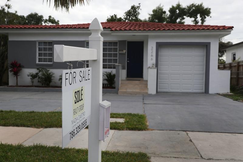 A "for sale" sign is seen in front of a home in Miami on Jan. 24, 2018. The partial shutdown of the federal government is causing some financial problems for furloughed workers who can't refinance their mortgages or buy homes because lenders can't verify A "for sale" sign is seen in front of a home in Miami on Jan. 24, 2018. The partial shutdown of the federal government is causing some financial problems for furloughed workers who can't refinance their mortgages or buy homes because lenders can't verify