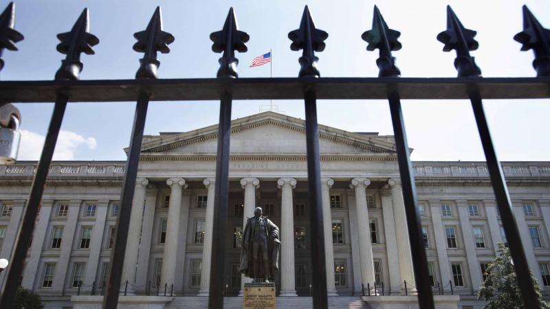 A statue of former Treasury Secretary Albert Gallatin stands guard outside the Treasury Building in Washington. Trump's campaign plans for a total overhaul of the U.S. tax code — while maintaining the revenues flowing into the federal government — may A statue of former Treasury Secretary Albert Gallatin stands guard outside the Treasury Building in Washington. Trump's campaign plans for a total overhaul of the U.S. tax code — while maintaining the revenues flowing into the federal government — may