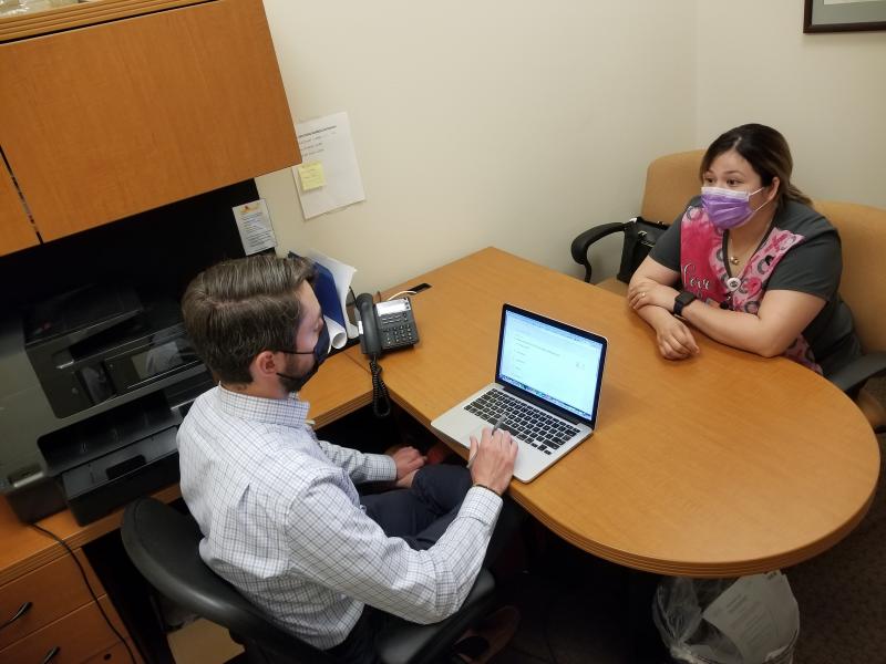Attorney Marc Scanlon meets with client Kimberly Ledezma at Salud Family Health Centers' clinic in Commerce City, Colo. Every day in this Denver suburb, four lawyers join the clinic's physicians, psychiatrists and social workers to consult on cases, as pa Attorney Marc Scanlon meets with client Kimberly Ledezma at Salud Family Health Centers' clinic in Commerce City, Colo. Every day in this Denver suburb, four lawyers join the clinic's physicians, psychiatrists and social workers to consult on cases, as pa