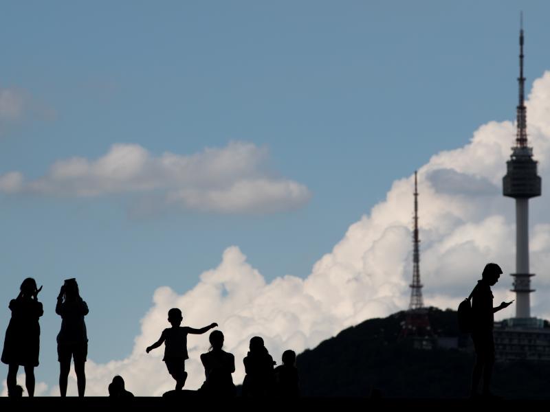 The silhouettes of people are seen as they stand outside the War Memorial of Korea museum in Seoul, South Korea, on Friday, Aug. 11, 2017. The silhouettes of people are seen as they stand outside the War Memorial of Korea museum in Seoul, South Korea, on Friday, Aug. 11, 2017.