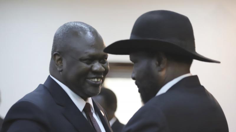 South Sudanese Vice President Riek Machar (left) shares a smile with President Salva Kiir after a swearing-in ceremony Saturday in the capital, Juba. Observers hope their newly forged coalition spells an end to civil war. South Sudanese Vice President Riek Machar (left) shares a smile with President Salva Kiir after a swearing-in ceremony Saturday in the capital, Juba. Observers hope their newly forged coalition spells an end to civil war.