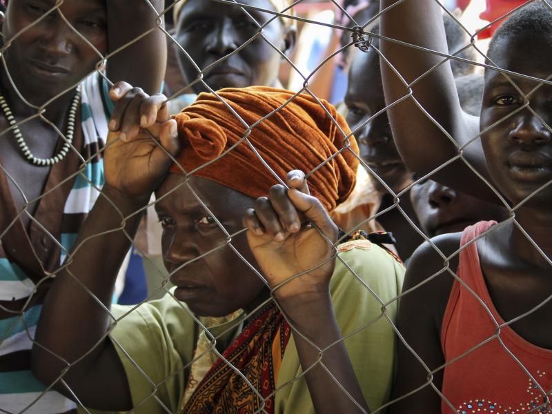 In this photo taken Monday, Nov. 14, 2016, women stand outside a U.N. Refugee Agency site in Yei, in southern South Sudan. The formerly peaceful town of Yei is now a center of the renewed civil war. In this photo taken Monday, Nov. 14, 2016, women stand outside a U.N. Refugee Agency site in Yei, in southern South Sudan. The formerly peaceful town of Yei is now a center of the renewed civil war.