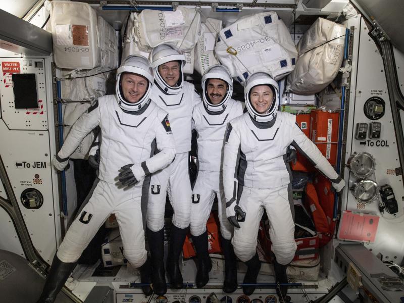 In this photo made available by NASA, commercial crew astronauts, from left, European Space Agency astronaut Matthias Maurer, and NASA astronauts Tom Marshburn, Raja Chari, and Kayla Barron, pose for a photo in their Dragon spacesuits during a fit check a In this photo made available by NASA, commercial crew astronauts, from left, European Space Agency astronaut Matthias Maurer, and NASA astronauts Tom Marshburn, Raja Chari, and Kayla Barron, pose for a photo in their Dragon spacesuits during a fit check a