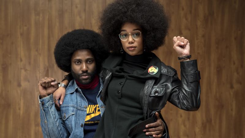 Ron (John David Washington) and Patrice (Laura Harrier) strike power poses in Spike Lee's BlacKkKlansman. Ron (John David Washington) and Patrice (Laura Harrier) strike power poses in Spike Lee's BlacKkKlansman.