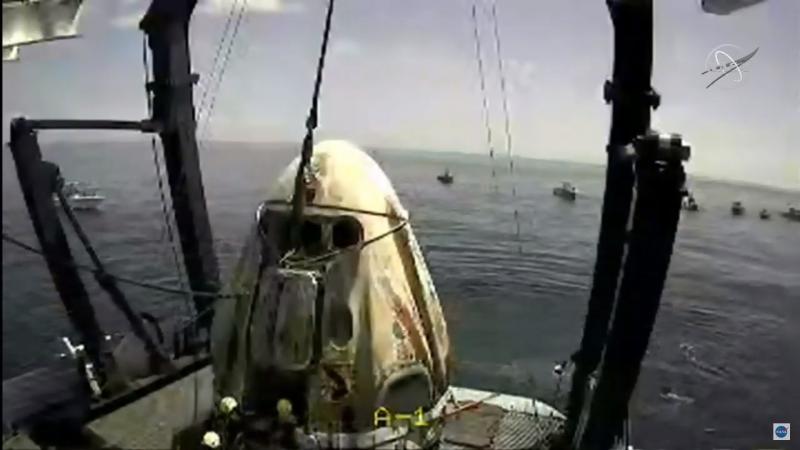 The SpaceX capsule sits aboard a recovery ship in the Gulf of Mexico. The SpaceX capsule sits aboard a recovery ship in the Gulf of Mexico.