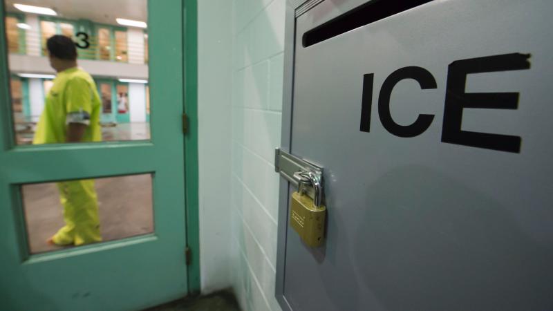 An immigration detainee stands near a U.S. Immigration and Customs Enforcement (ICE) grievance box last month in the high security unit at the Theo Lacy Facility, a county jail in Orange, Calif., that also houses immigration detainees arrested by ICE. An immigration detainee stands near a U.S. Immigration and Customs Enforcement (ICE) grievance box last month in the high security unit at the Theo Lacy Facility, a county jail in Orange, Calif., that also houses immigration detainees arrested by ICE.