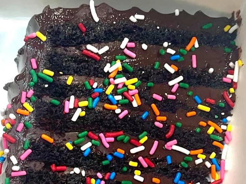 A slice of the 12-layer chocolate cake known as "Bruce" is adorned with colorful sprinkles at the British bakery Get Baked. But regulators say the topping is illegal, as it includes a color additive that is permitted only for other uses. A slice of the 12-layer chocolate cake known as "Bruce" is adorned with colorful sprinkles at the British bakery Get Baked. But regulators say the topping is illegal, as it includes a color additive that is permitted only for other uses.