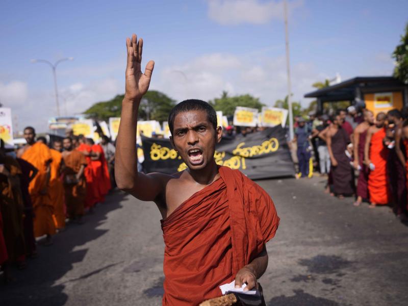A student monk representing Inter University Students Federation shouts slogans during an anti government protest in Colombo, Sri Lanka, Thursday, May 19, 2022. Sri Lankans have been protesting for more than a month demanding the resignation of President A student monk representing Inter University Students Federation shouts slogans during an anti government protest in Colombo, Sri Lanka, Thursday, May 19, 2022. Sri Lankans have been protesting for more than a month demanding the resignation of President