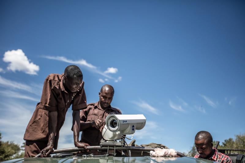 Field technicians at Mara Conservancy install a mobile camera unit to help nab poachers. Field technicians at Mara Conservancy install a mobile camera unit to help nab poachers.