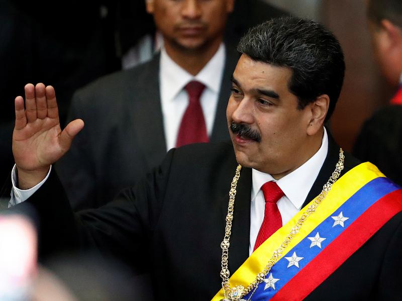 Venezuela's sitting president, Nicolás Maduro, attends a ceremony Thursday in Caracas to mark the opening of the judicial year at the Supreme Court of Justice. Opposition leader Juan Guaidó has declared himself the interim president, but Maduro has not Venezuela's sitting president, Nicolás Maduro, attends a ceremony Thursday in Caracas to mark the opening of the judicial year at the Supreme Court of Justice. Opposition leader Juan Guaidó has declared himself the interim president, but Maduro has not