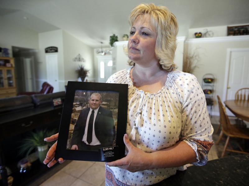 Laurie Holt holds a photograph of her son, Joshua Holt, at her home, in Riverton, Utah. Holt, who has been held in a Venezuelan jail for two years, uploaded a video plea for his released to Facebook this week. Laurie Holt holds a photograph of her son, Joshua Holt, at her home, in Riverton, Utah. Holt, who has been held in a Venezuelan jail for two years, uploaded a video plea for his released to Facebook this week.