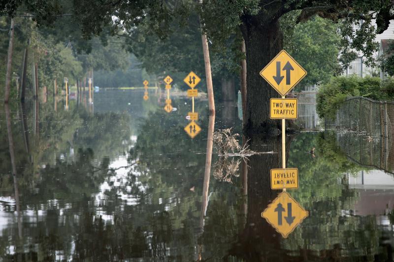 A flooded street in Orange, Texas in 2017. Climate-driven extreme rain and sea level rise, coupled with development in flood-prone areas, have led to more competition for limited federal flood mitigation dollars. A flooded street in Orange, Texas in 2017. Climate-driven extreme rain and sea level rise, coupled with development in flood-prone areas, have led to more competition for limited federal flood mitigation dollars.