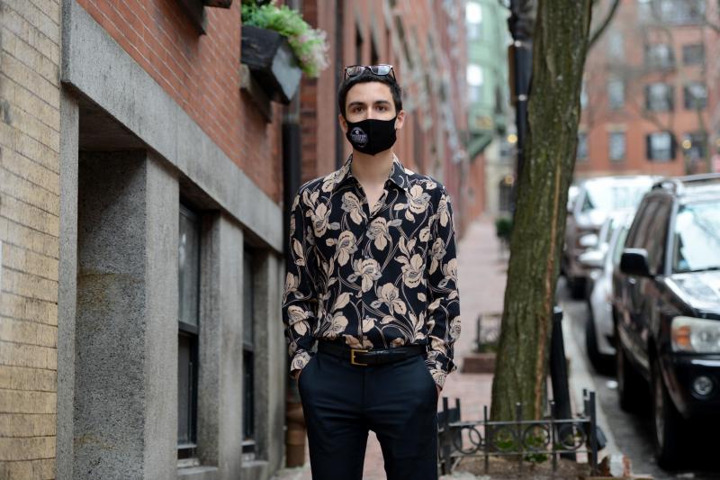 Gabriel Toro, 23, stands on the sidewalk near his apartment in Boston on March 11. Toro completed the credits required for a bachelor's degree from the University of Massachusetts Boston but the school wouldn't release Toro's transcript or degree because Gabriel Toro, 23, stands on the sidewalk near his apartment in Boston on March 11. Toro completed the credits required for a bachelor's degree from the University of Massachusetts Boston but the school wouldn't release Toro's transcript or degree because
