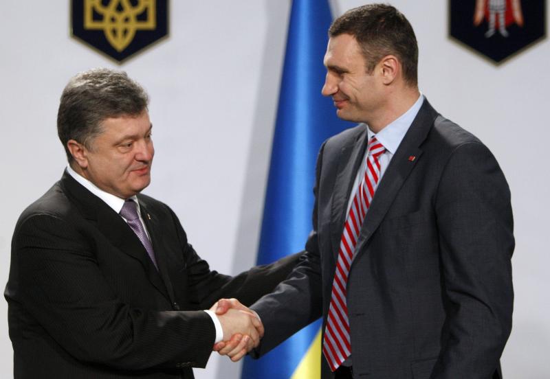 Boxer-turned-opposition leader Vitali Klitschko, right, dropped out of Ukraine's presidential election set for May 25. He says he will help business tycoon and politician Petro Poroshenko, left, who made a fortune selling chocolates. He favors closer ties Boxer-turned-opposition leader Vitali Klitschko, right, dropped out of Ukraine's presidential election set for May 25. He says he will help business tycoon and politician Petro Poroshenko, left, who made a fortune selling chocolates. He favors closer ties
