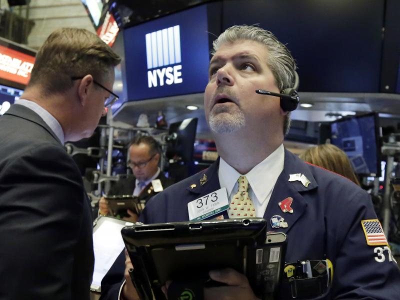 Trader John Panin works on the floor of the New York Stock Exchange on Tuesday. U.S. stock markets fell as U.S.-China trade tensions grew. Trader John Panin works on the floor of the New York Stock Exchange on Tuesday. U.S. stock markets fell as U.S.-China trade tensions grew.