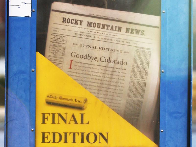A copy of the final edition of the Rocky Mountain News sits in a newspaper box on a street corner in Denver, Colorado. A copy of the final edition of the Rocky Mountain News sits in a newspaper box on a street corner in Denver, Colorado.