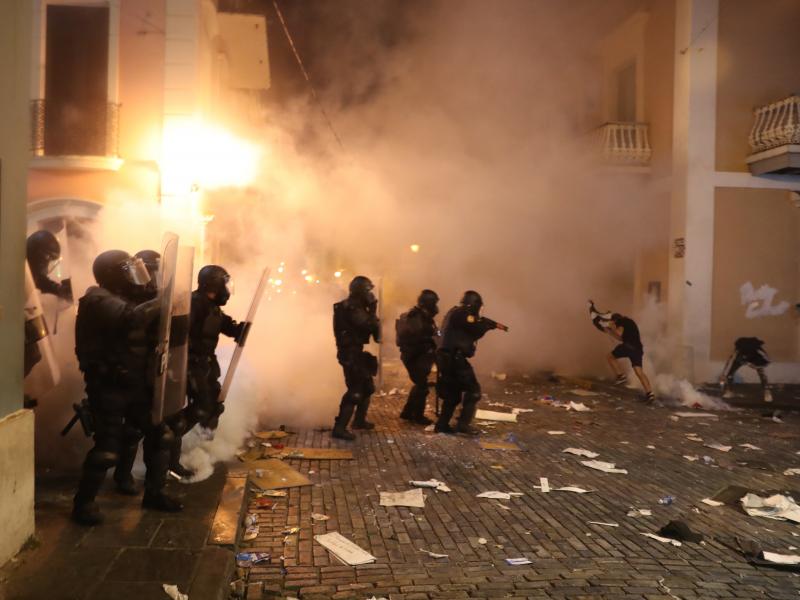 Police used tear gas against protesters on Wednesday in Old San Juan, Puerto Rico. Police used tear gas against protesters on Wednesday in Old San Juan, Puerto Rico.