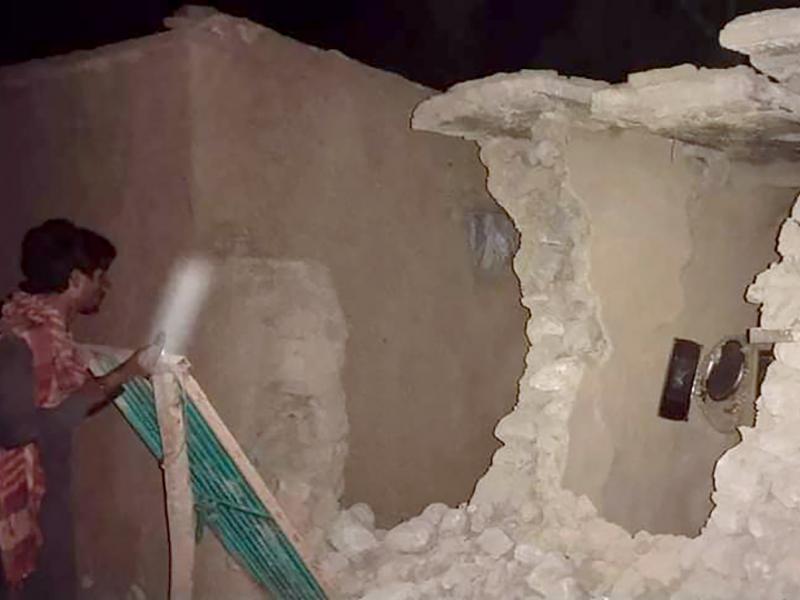 A local resident looks at his damaged house following a severe earthquake that hit the area in Harnai, about 60 miles from Quetta, Pakistan. A powerful earthquake shook parts of southwestern Pakistan early Thursday. A local resident looks at his damaged house following a severe earthquake that hit the area in Harnai, about 60 miles from Quetta, Pakistan. A powerful earthquake shook parts of southwestern Pakistan early Thursday.