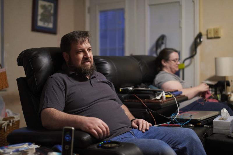 Drew Lehman and his wife, Laura, sit on the family's big leather couch. Lehman says it's the most comfortable place for him. Drew Lehman and his wife, Laura, sit on the family's big leather couch. Lehman says it's the most comfortable place for him.