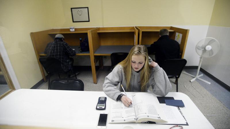 Rachel Barr, 17, of Scarborough, Maine, takes a practice SAT Test in a room with other students on February 23, 2016. The redesigned SAT is being administered to high school students for the first time Saturday. Rachel Barr, 17, of Scarborough, Maine, takes a practice SAT Test in a room with other students on February 23, 2016. The redesigned SAT is being administered to high school students for the first time Saturday.