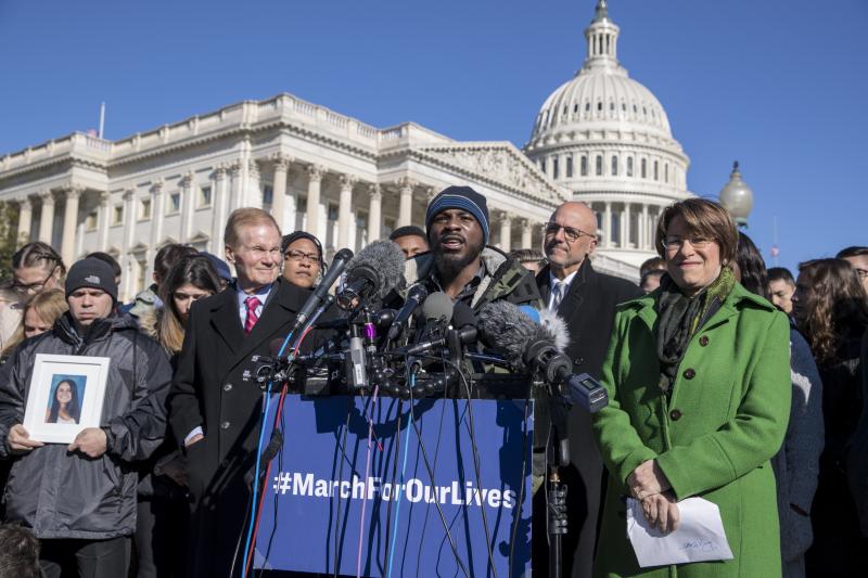 Robert Edwards, a student from Washington, speaks alongside lawmakers and gun control activists at the U.S. Capitol, a day before the "March for Our Lives." From left are Ilan Alhadeff holding a photograph of his daughter, Alyssa, a 14-year-old Parkland v Robert Edwards, a student from Washington, speaks alongside lawmakers and gun control activists at the U.S. Capitol, a day before the "March for Our Lives." From left are Ilan Alhadeff holding a photograph of his daughter, Alyssa, a 14-year-old Parkland v