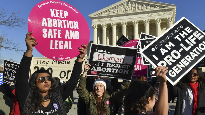 Demonstrators on both sides of the abortion debate rally outside the U.S. Supreme Court on Jan. 19, 2018. Demonstrators on both sides of the abortion debate rally outside the U.S. Supreme Court on Jan. 19, 2018.