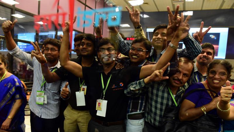 Scientists and officials of Indian Space Research Organization pose for photos as they celebrate the success of Mars Orbiter Mission (MoM) on Wednesday. Scientists and officials of Indian Space Research Organization pose for photos as they celebrate the success of Mars Orbiter Mission (MoM) on Wednesday.