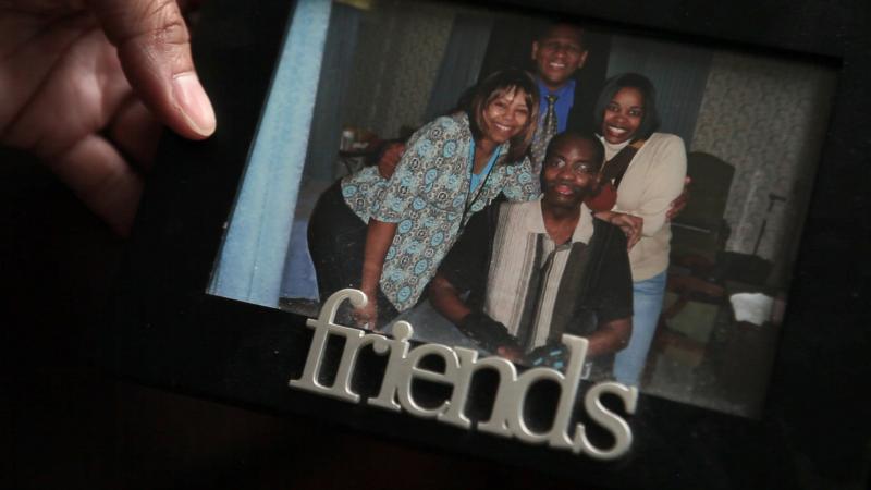 Kelli Glenn holds a photo of her father while he was in the hospital. Kelli Glenn holds a photo of her father while he was in the hospital.