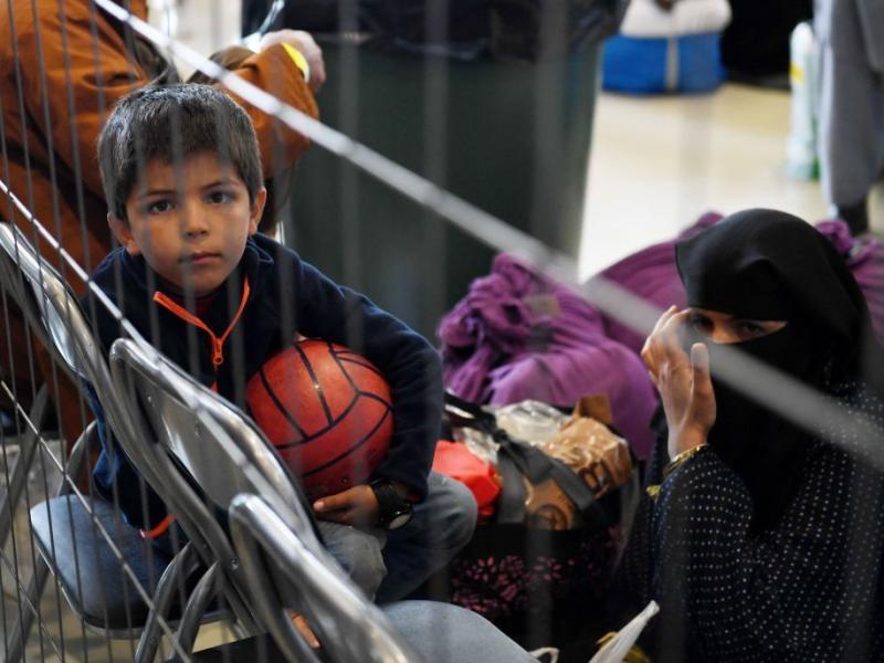 Afghan refugees wait to be processed Sept. 8 inside Hangar 5 at Ramstein Air Base in Germany. Afghan refugees wait to be processed Sept. 8 inside Hangar 5 at Ramstein Air Base in Germany.