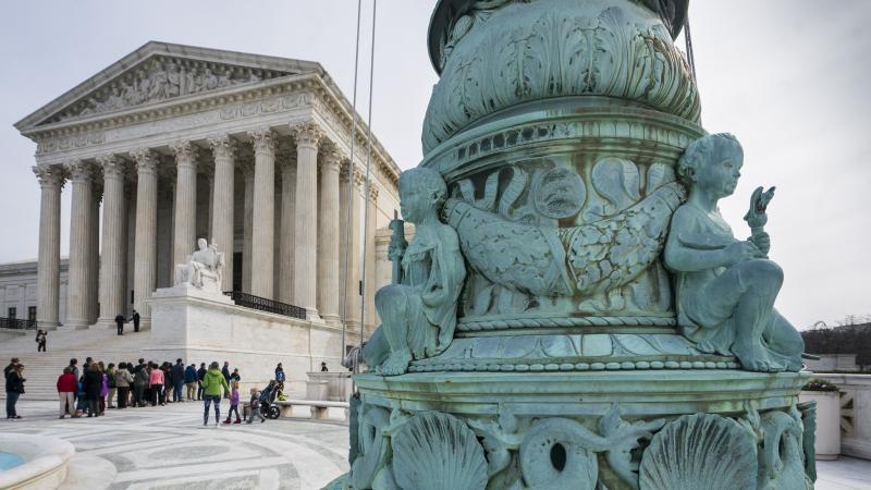 People line up to enter the Supreme Court in Washington, Wednesday. People line up to enter the Supreme Court in Washington, Wednesday.
