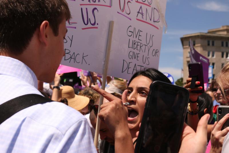 An abortion-rights supporter argues with an anti-abortion-rights protester in front of the U.S. Supreme Court on May 21 during demonstrations in defense of abortion rights. An abortion-rights supporter argues with an anti-abortion-rights protester in front of the U.S. Supreme Court on May 21 during demonstrations in defense of abortion rights.