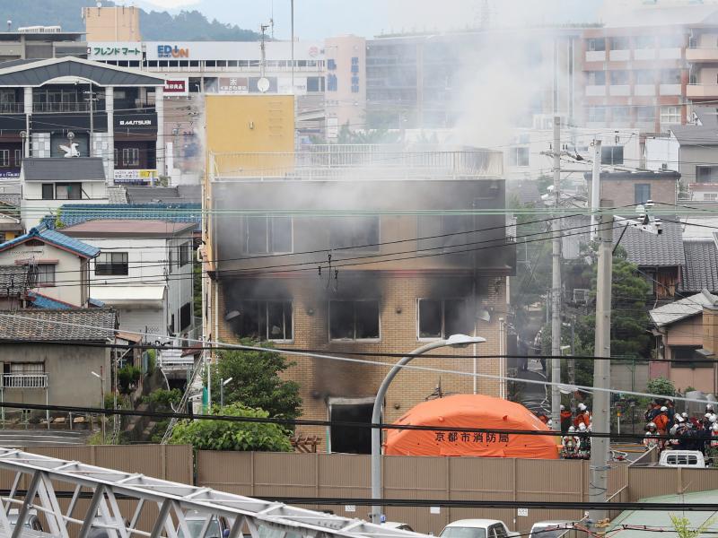 Smoke rises from an animation company building after a fire in Kyoto, Japan, on Thursday. Smoke rises from an animation company building after a fire in Kyoto, Japan, on Thursday.