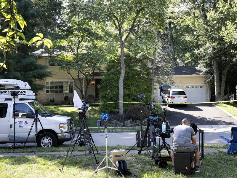 News media set up in front of the home of U.S. District Judge Esther Salas on Monday in North Brunswick, N.J. A gunman posing as a delivery person shot and killed Salas' 20-year-old son Sunday. News media set up in front of the home of U.S. District Judge Esther Salas on Monday in North Brunswick, N.J. A gunman posing as a delivery person shot and killed Salas' 20-year-old son Sunday.