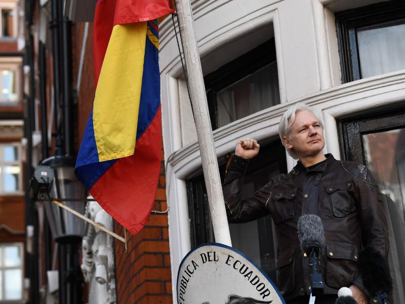 WikiLeaks founder Julian Assange raises his fist before addressing reporters from the balcony of the Ecuadorian Embassy in London on Friday. In his speech, Assange said there are still plenty of legal battles still to wage: "The proper war is just commenc WikiLeaks founder Julian Assange raises his fist before addressing reporters from the balcony of the Ecuadorian Embassy in London on Friday. In his speech, Assange said there are still plenty of legal battles still to wage: "The proper war is just commenc