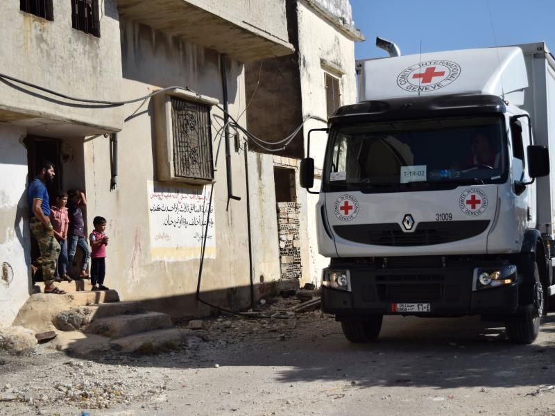 A Red Cross vehicle carrying aid arrives in the rebel-held town of Talbiseh, Syria, on Monday. A Red Cross vehicle carrying aid arrives in the rebel-held town of Talbiseh, Syria, on Monday.