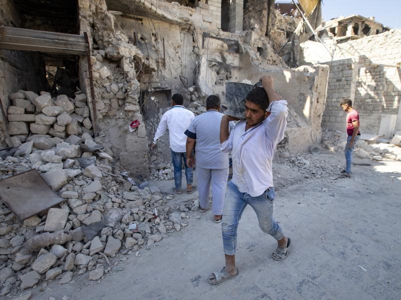 Volunteers clear the Old Market district of debris in Aleppo, Syria, in 2019. Years of fighting have left many sections of Aleppo destroyed. Volunteers clear the Old Market district of debris in Aleppo, Syria, in 2019. Years of fighting have left many sections of Aleppo destroyed.