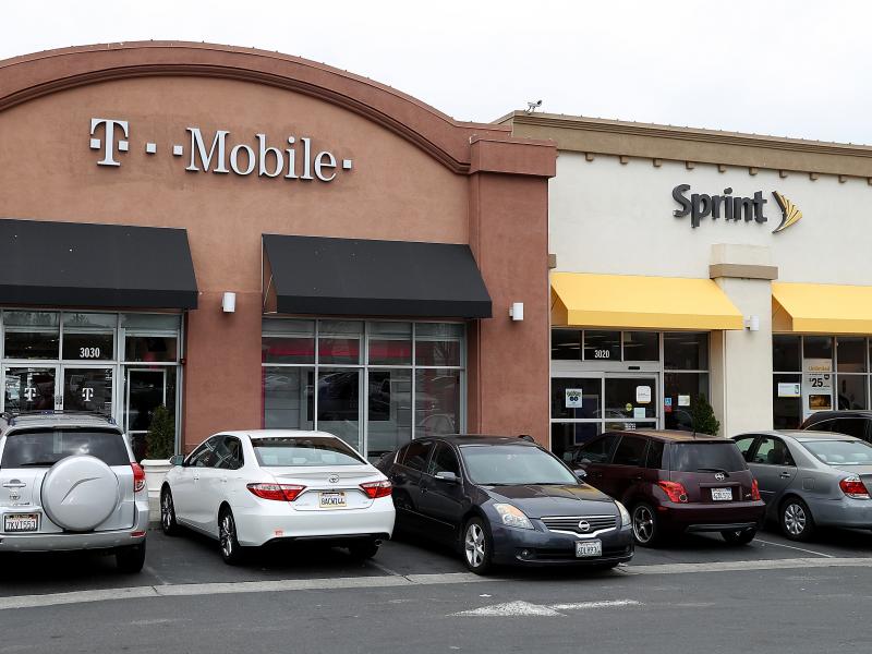 T-Mobile and Sprint stores in El Cerrito, Calif. The Department of Justice approved the $26 billion merger of the two wireless carriers. T-Mobile and Sprint stores in El Cerrito, Calif. The Department of Justice approved the $26 billion merger of the two wireless carriers.