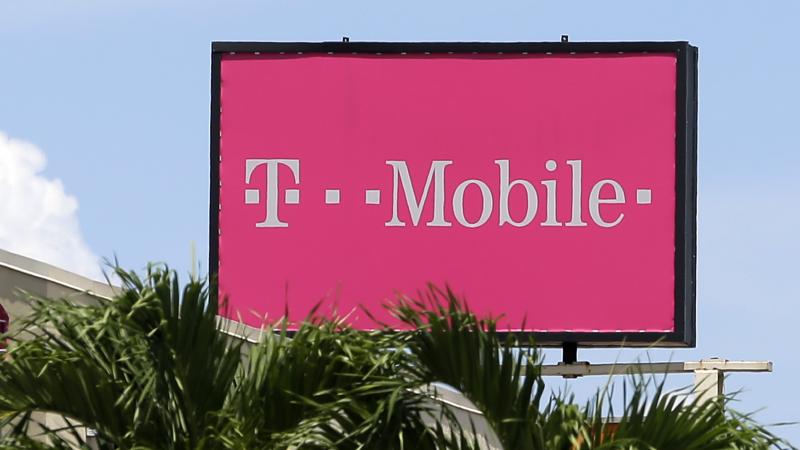 A billboard advertising T-Mobile stands over Hialeah, Fla., last year. A billboard advertising T-Mobile stands over Hialeah, Fla., last year.